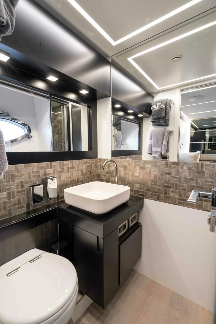 a bathroom with a sink and a toilet aboard STALLION Yacht for Sale