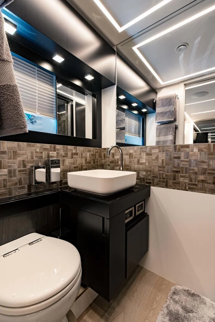 a bathroom with a sink and a toilet aboard STALLION Yacht for Sale