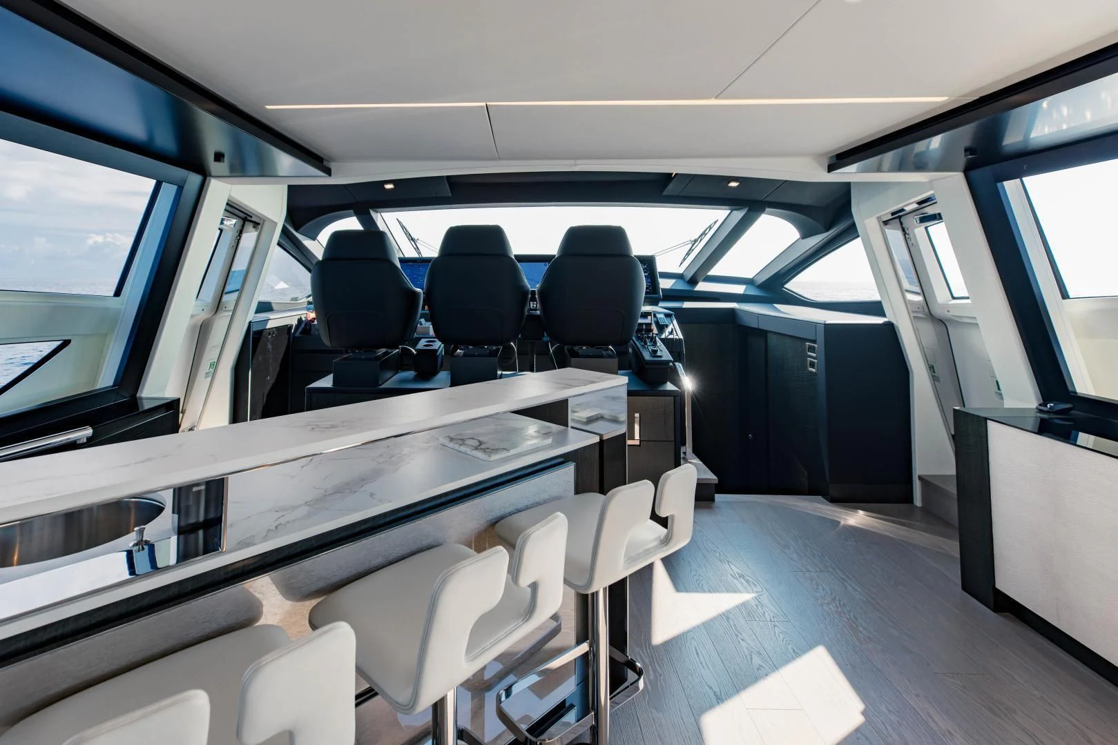 inside of a vehicle with chairs and desks aboard STALLION Yacht for Sale