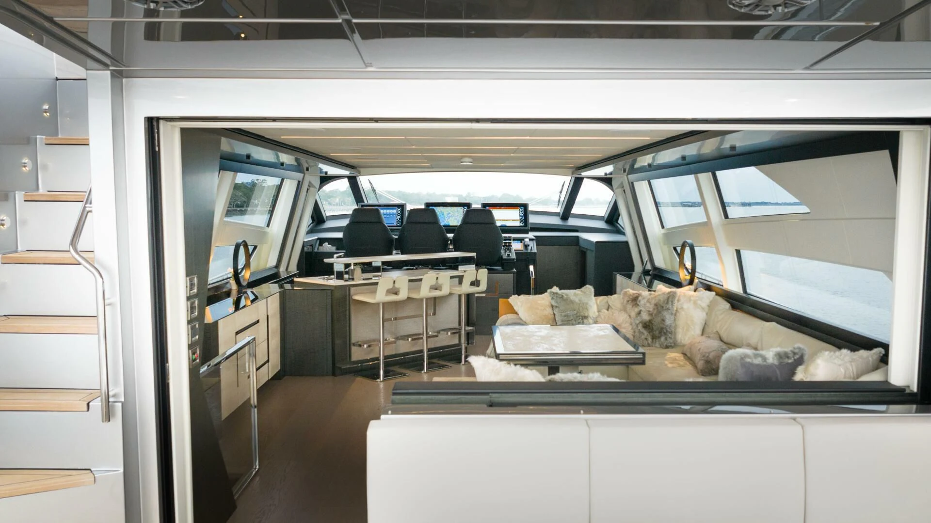 inside of a vehicle with a couch and a table and chairs aboard STALLION Yacht for Sale