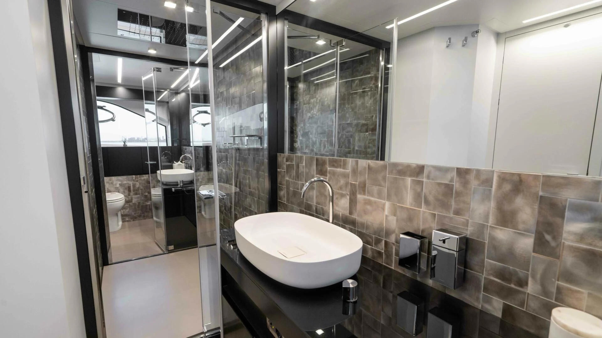 a bathroom with a sink and a mirror aboard STALLION Yacht for Sale