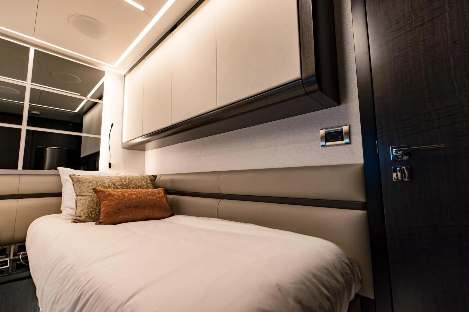 a bed with a white bed aboard STALLION Yacht for Sale