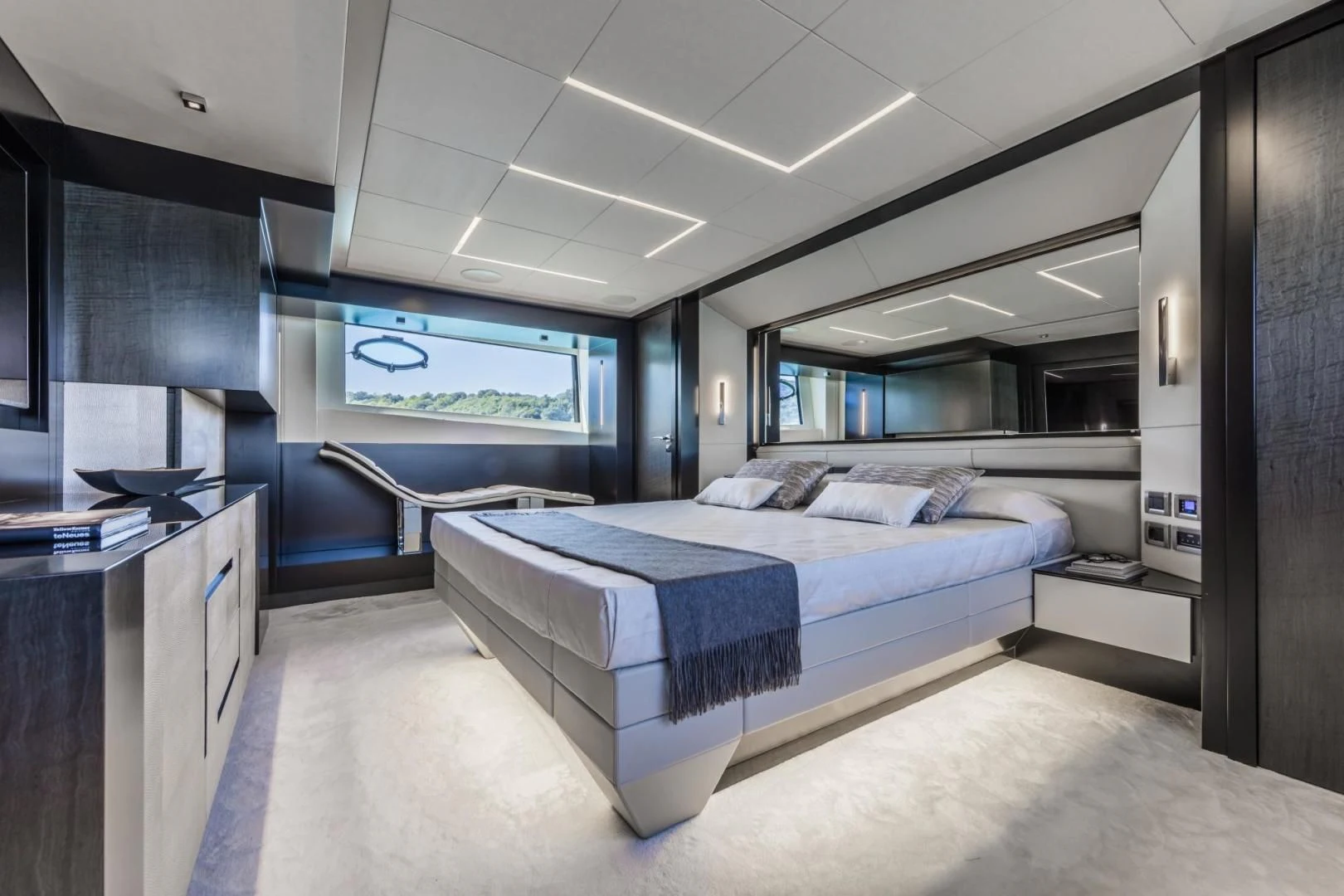 a room with a bed and a desk aboard STALLION Yacht for Sale