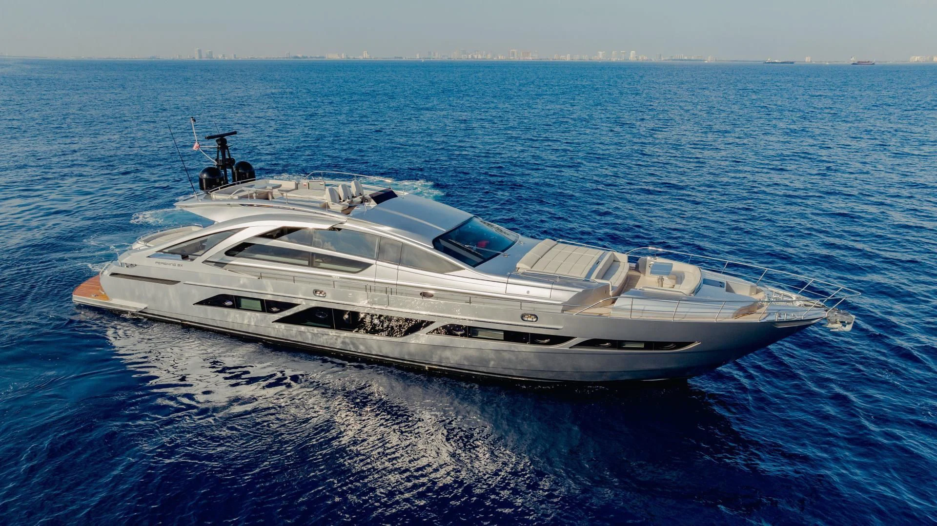 a white yacht in the water aboard STALLION Yacht for Sale