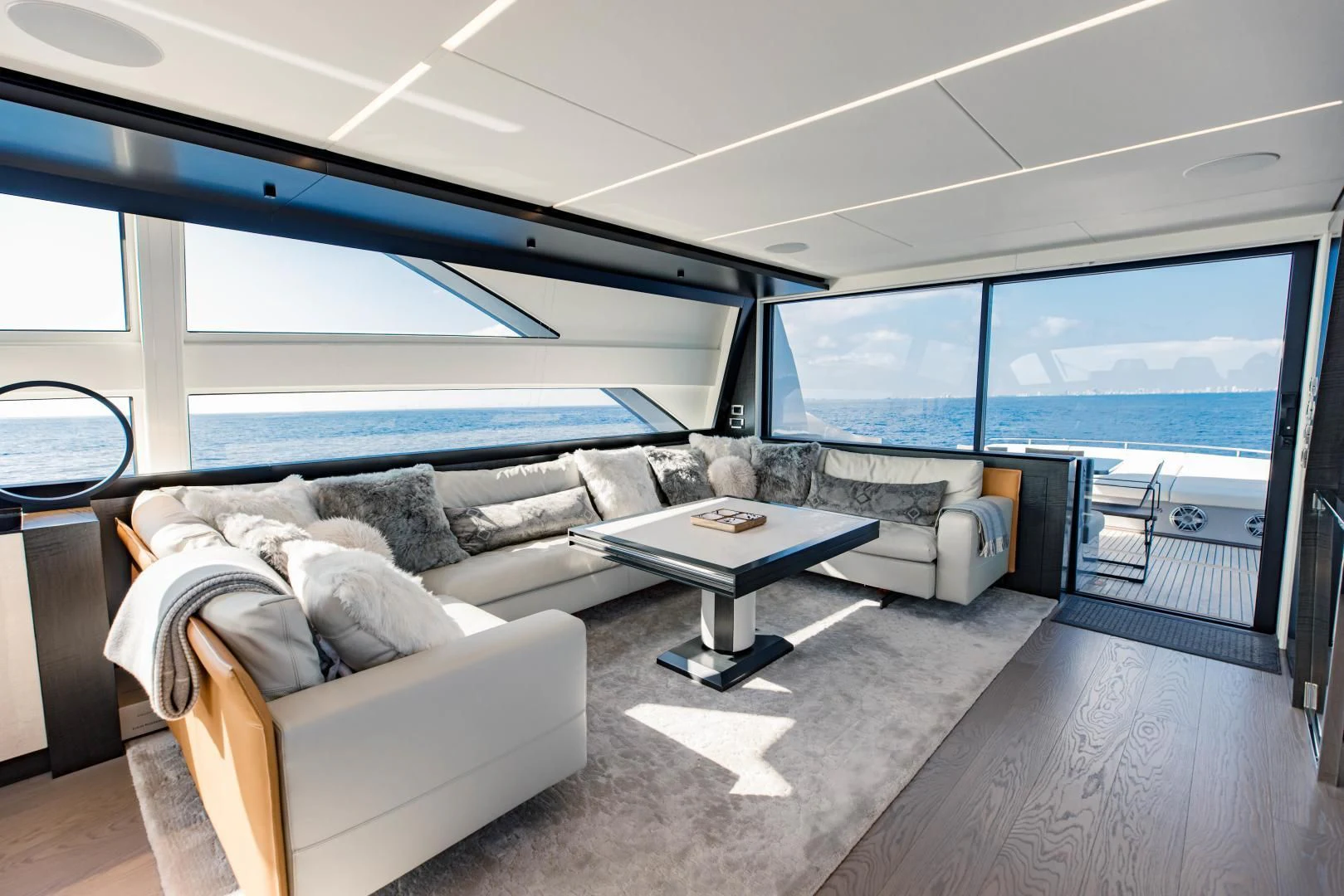 a living room with a large window aboard STALLION Yacht for Sale