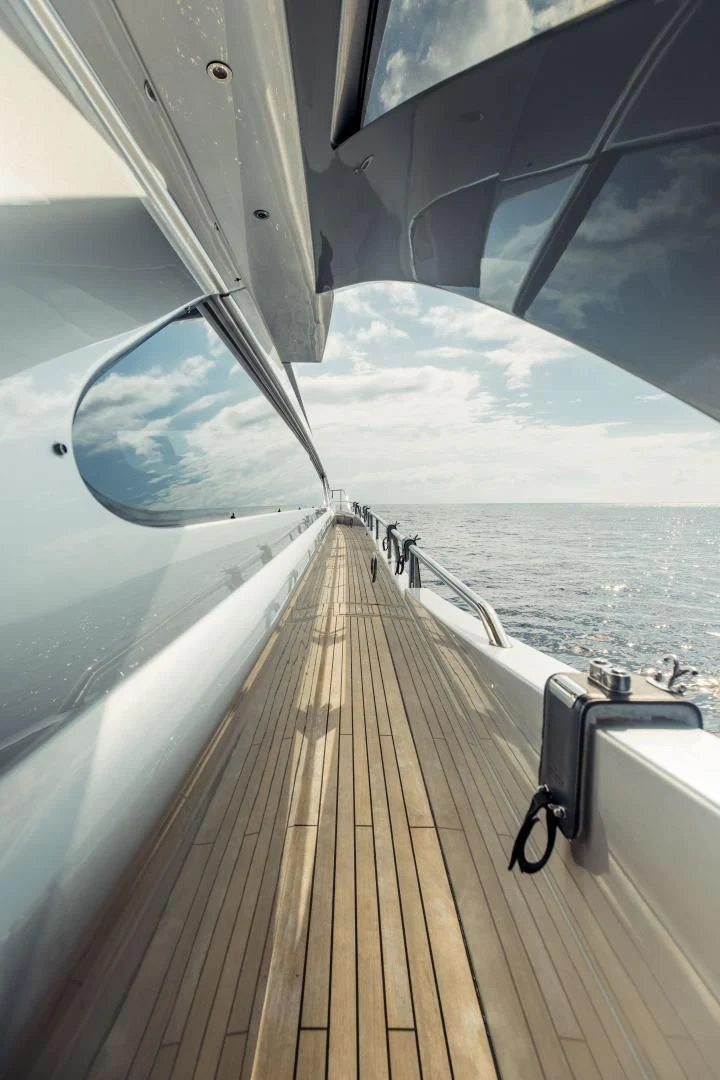 a boat with a person standing on the deck aboard STALLION Yacht for Sale