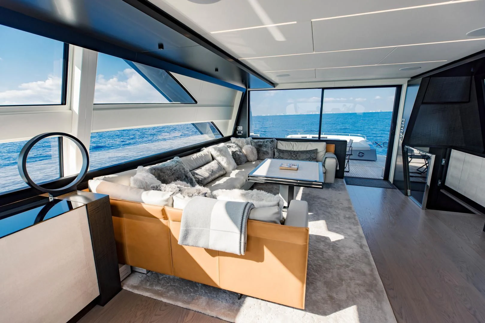 inside of a vehicle with a large window and a view of the ocean aboard STALLION Yacht for Sale