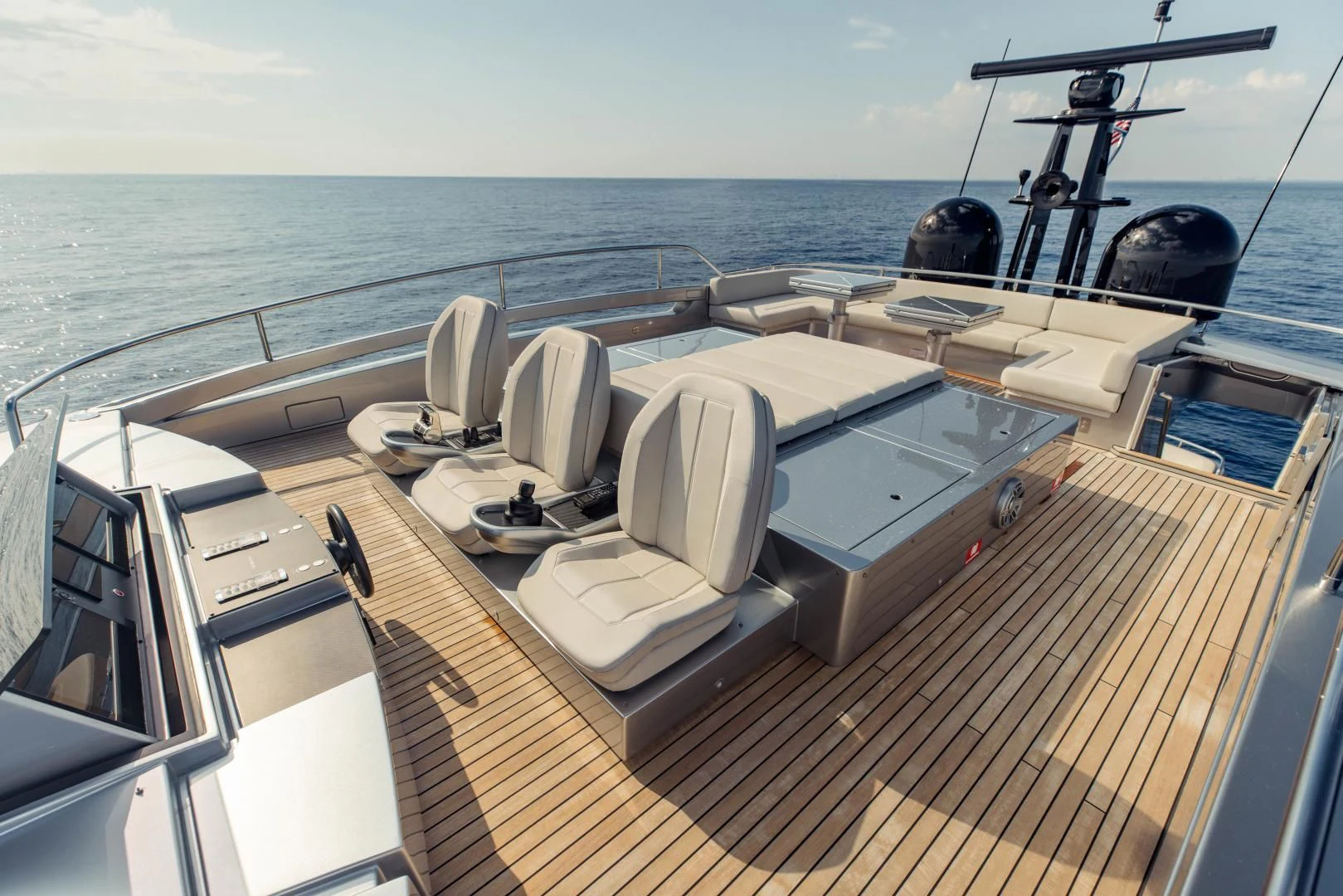 a deck with a large boat and chairs on it aboard STALLION Yacht for Sale