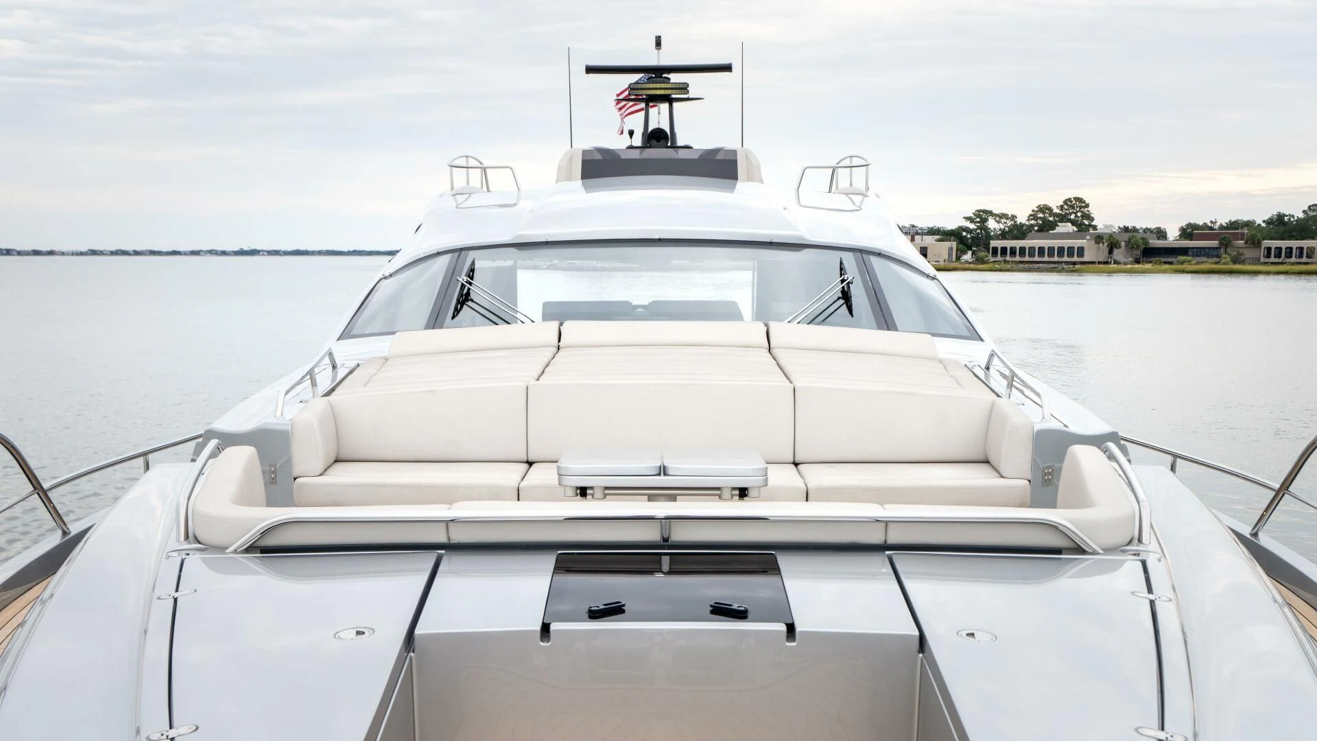 a white boat on a body of water aboard STALLION Yacht for Sale