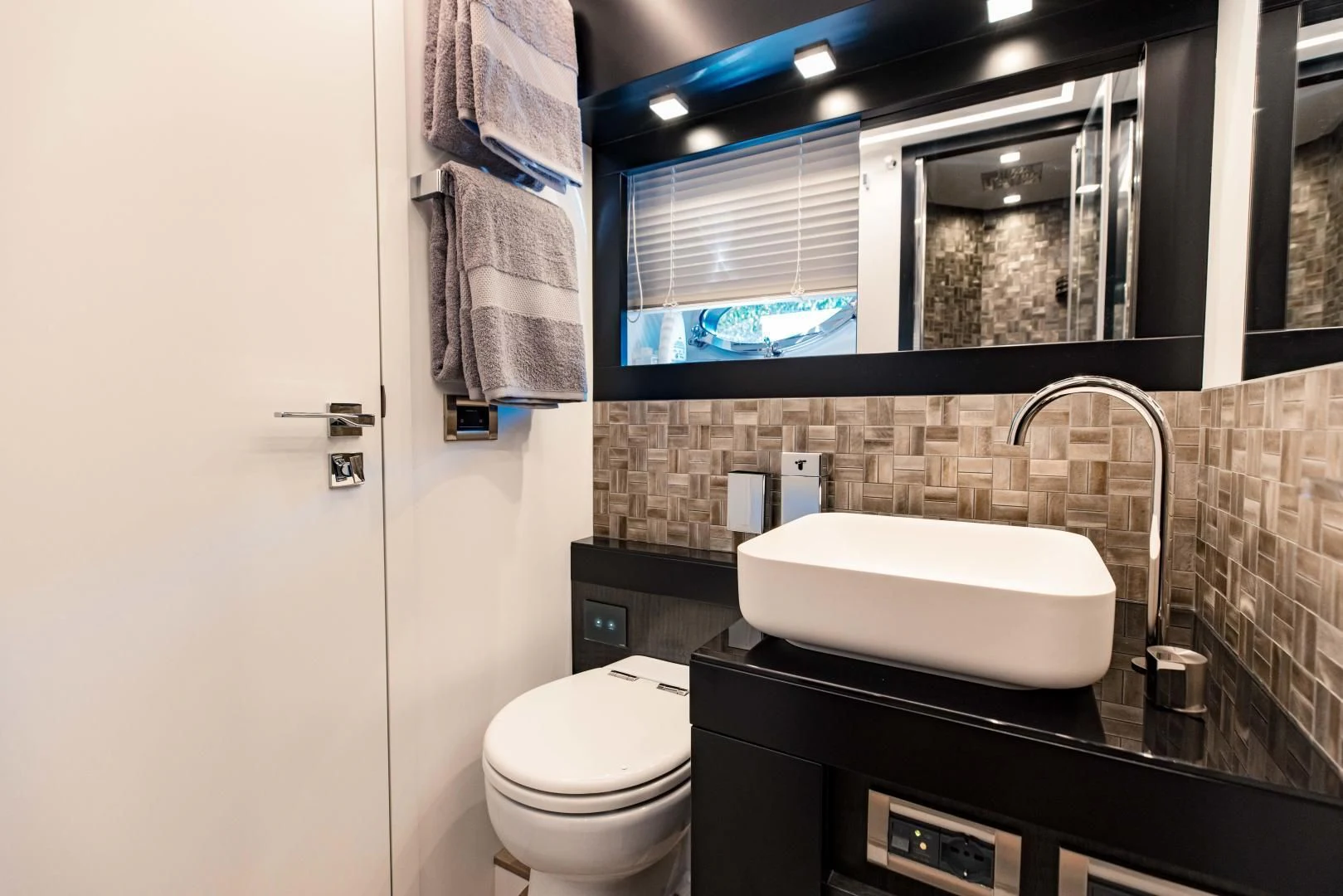 a bathroom with a sink and toilet aboard STALLION Yacht for Sale
