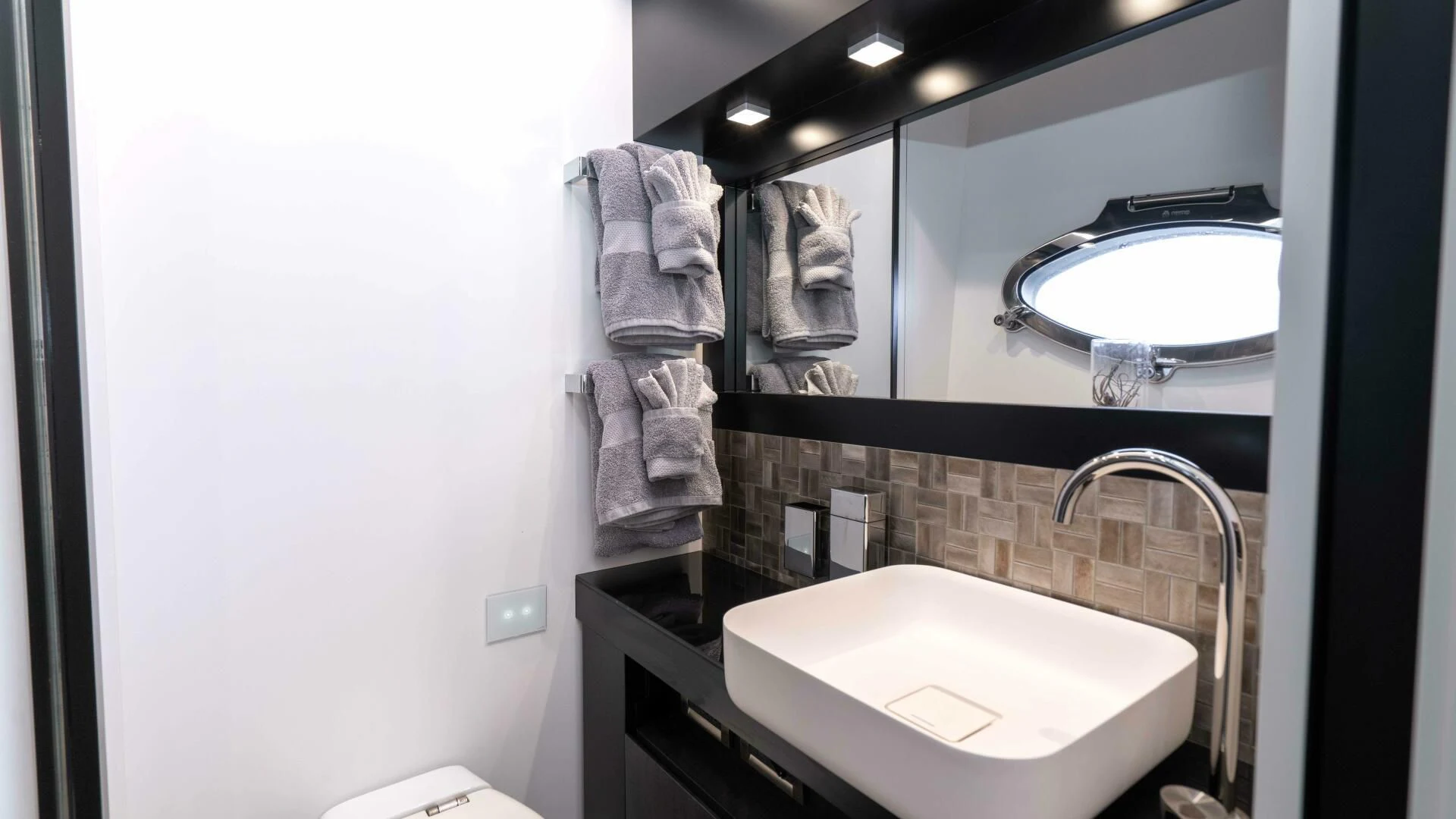 a bathroom with a sink and a mirror aboard STALLION Yacht for Sale