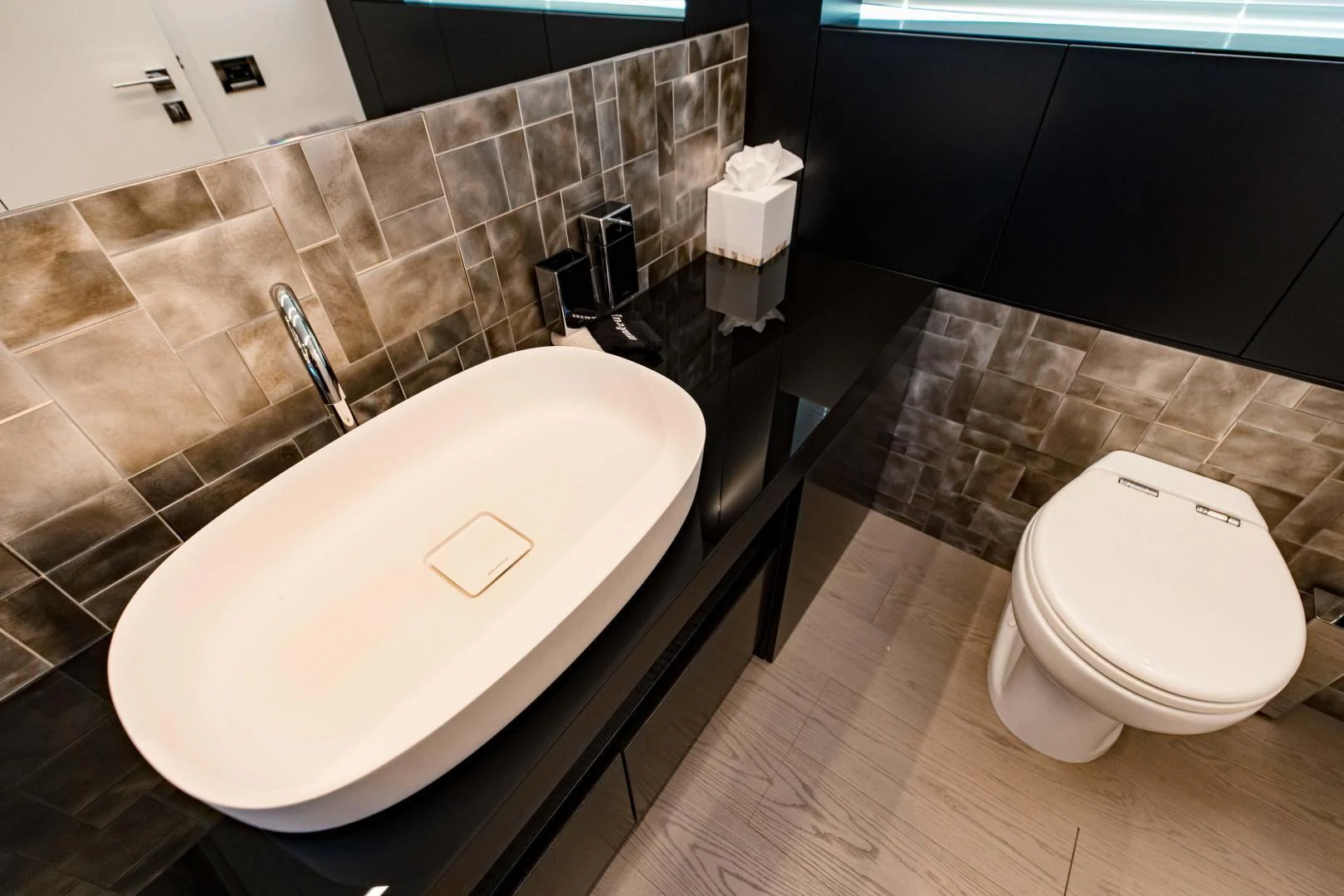 a bathroom with a sink and a toilet aboard STALLION Yacht for Sale