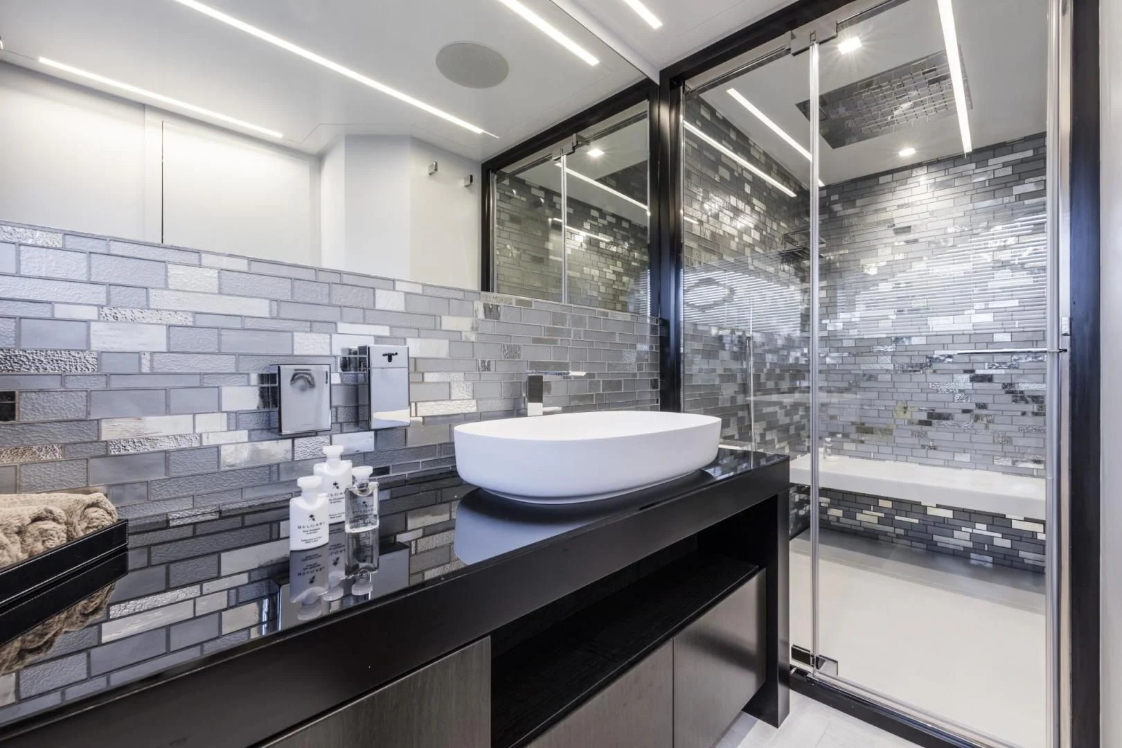 a bathroom with a sink and a mirror aboard STALLION Yacht for Sale