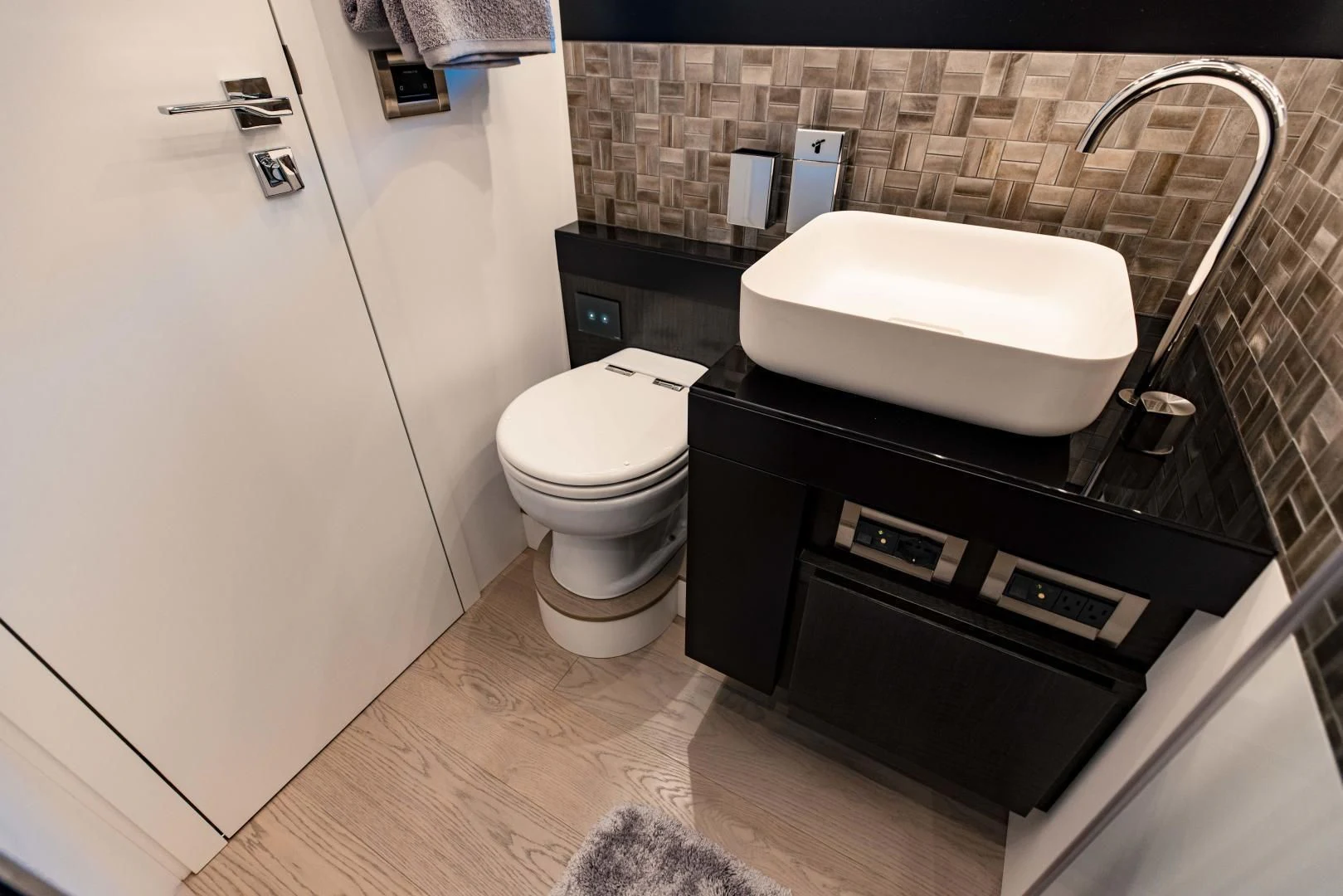a bathroom with a toilet and a bathtub aboard STALLION Yacht for Sale
