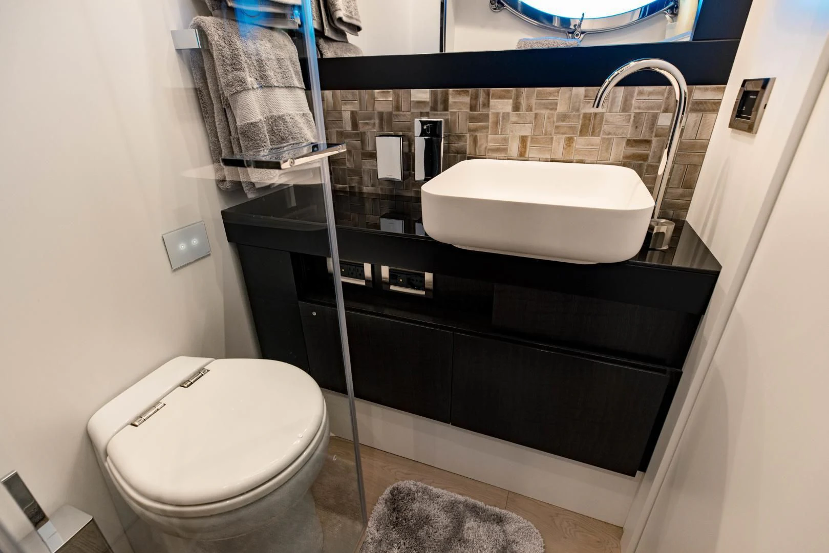 a bathroom with a sink and toilet aboard STALLION Yacht for Sale