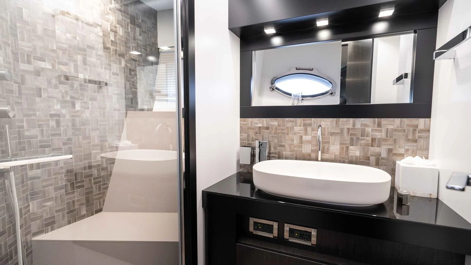 a bathroom with a sink and a bathtub aboard STALLION Yacht for Sale