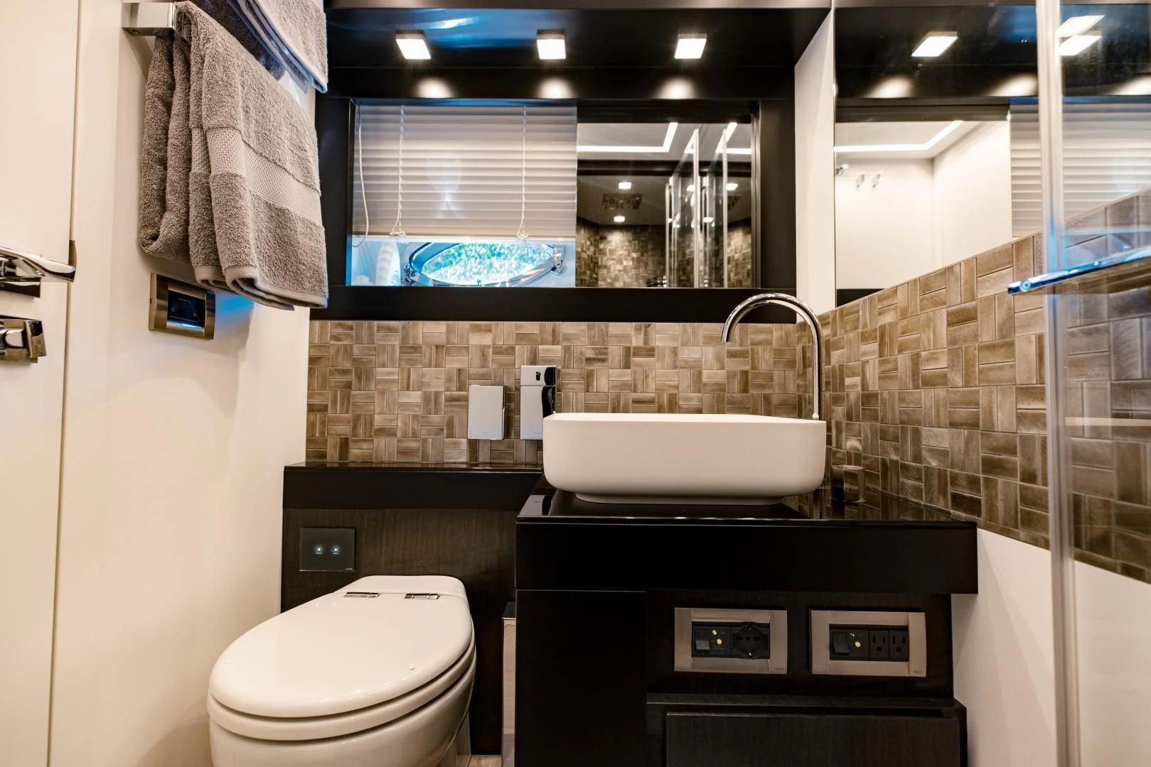 a bathroom with a sink and toilet aboard STALLION Yacht for Sale