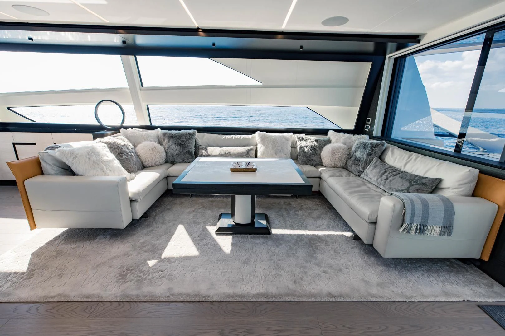 a couch and a table in a room aboard STALLION Yacht for Sale