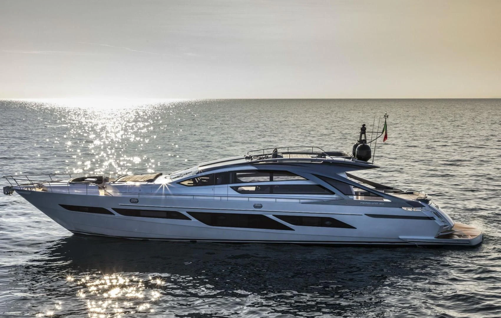 a white yacht in the water aboard STALLION Yacht for Sale