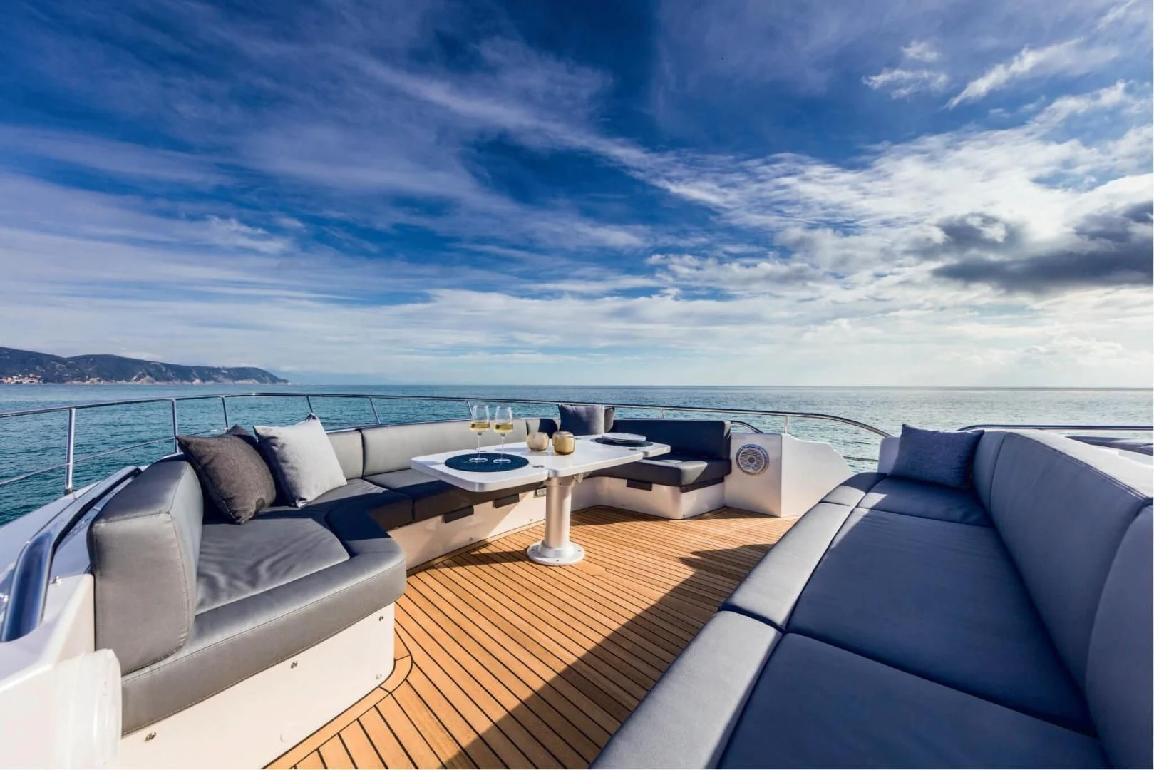 a large bed with a table on it aboard STALLION Yacht for Sale