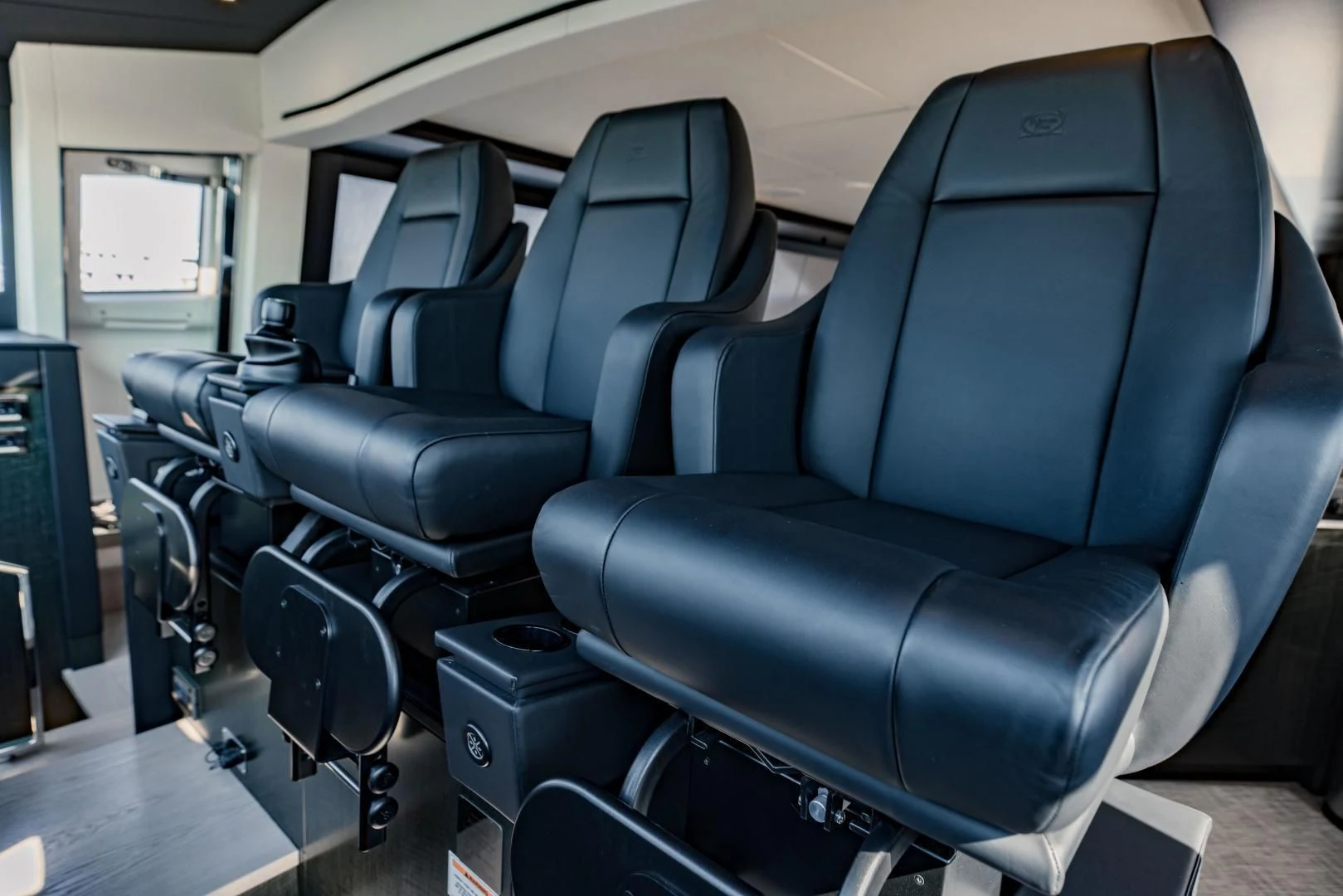 a room with chairs and a table aboard STALLION Yacht for Sale