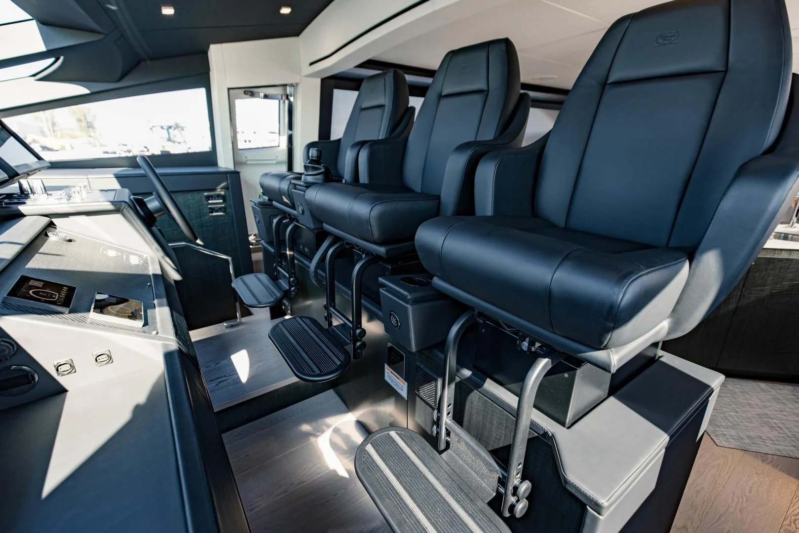 a room with a row of seats aboard STALLION Yacht for Sale