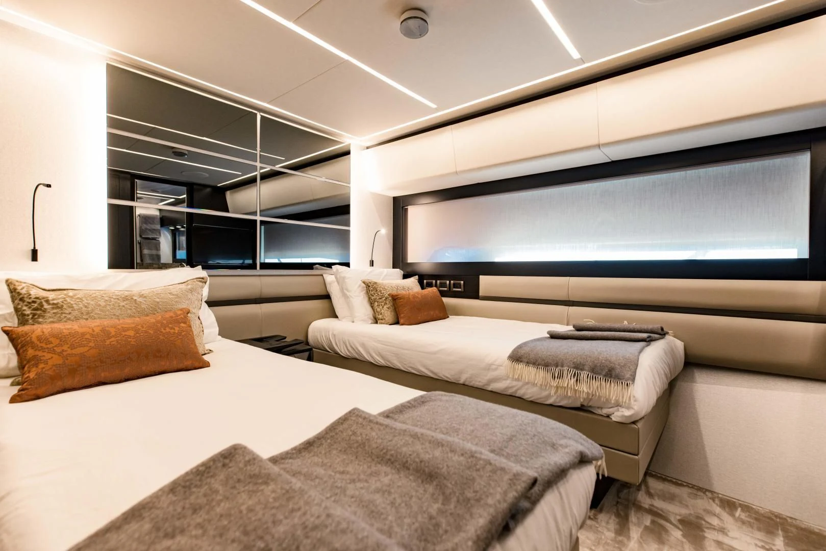 a room with a bed and a tv aboard STALLION Yacht for Sale