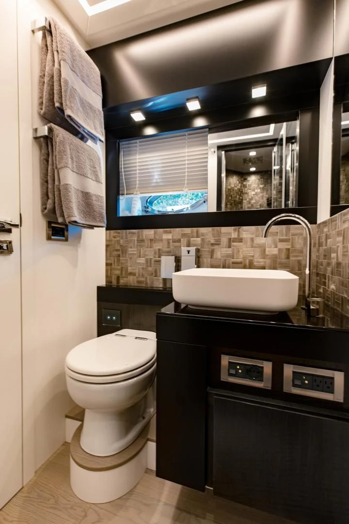 a bathroom with a sink and a toilet aboard STALLION Yacht for Sale