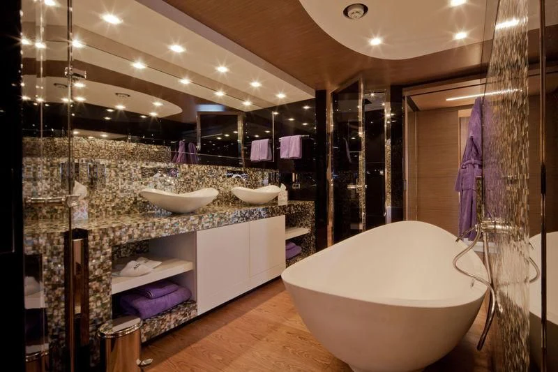 a bathroom with a large bathtub aboard AZIZA Yacht for Sale