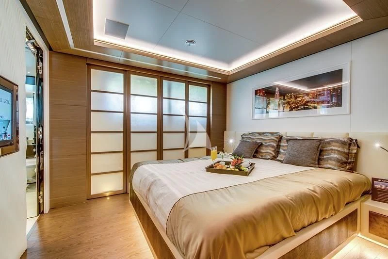 a bed in a room aboard AZIZA Yacht for Sale