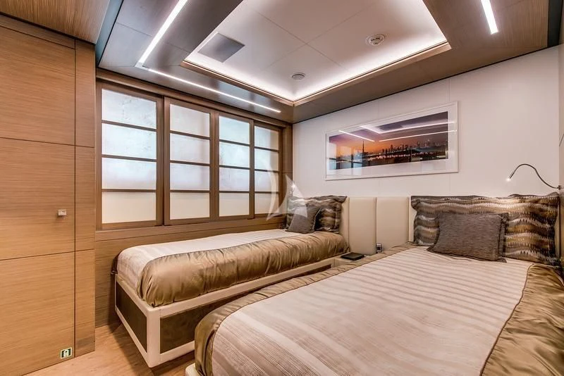 a room with two beds aboard AZIZA Yacht for Sale