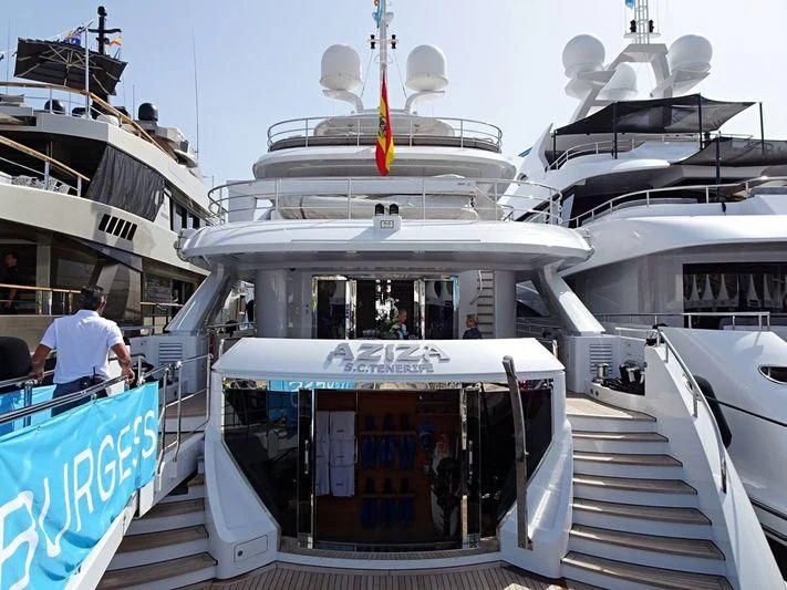 a boat with a deck and a walkway between it aboard AZIZA Yacht for Sale