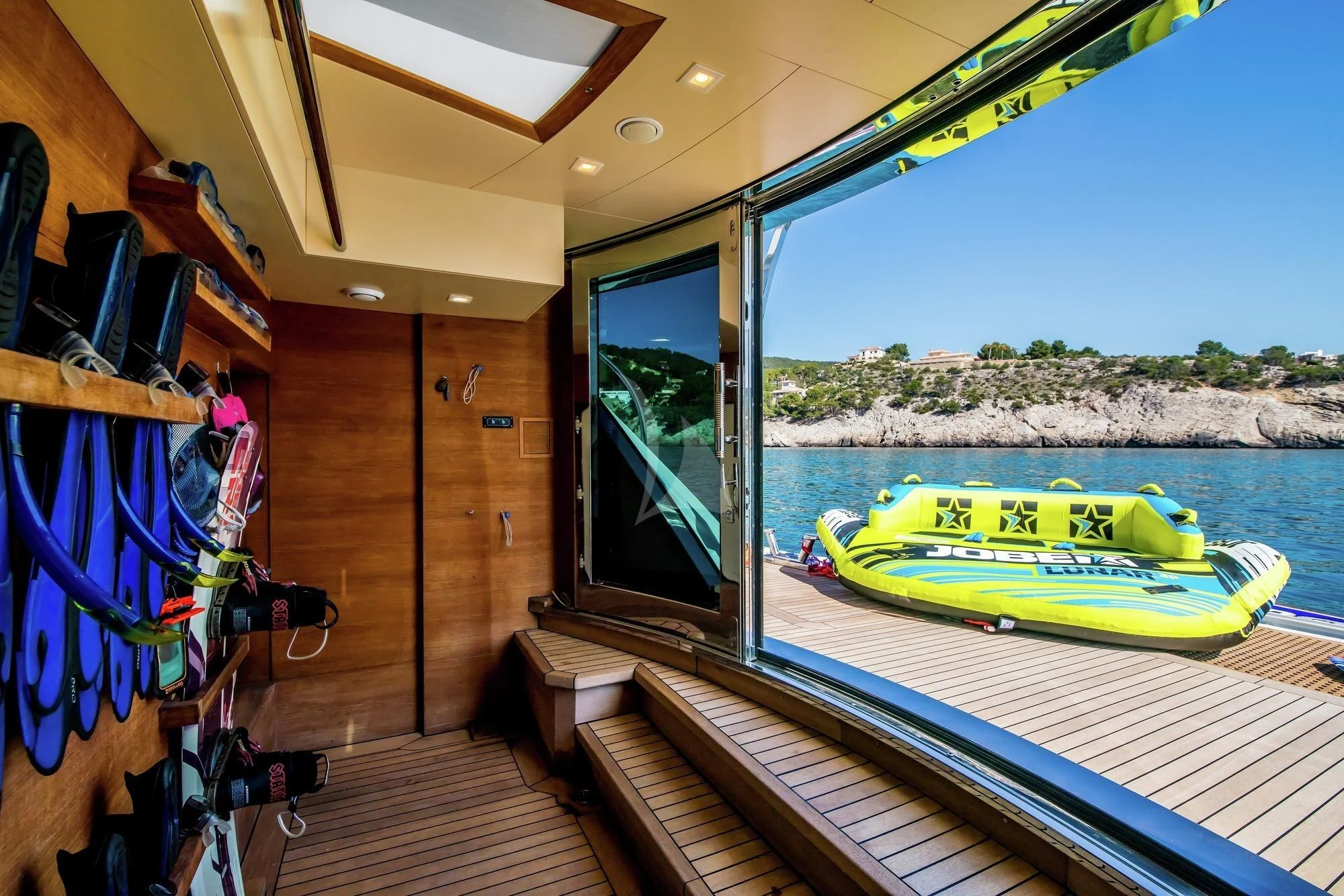 a boat on a deck aboard AZIZA Yacht for Sale