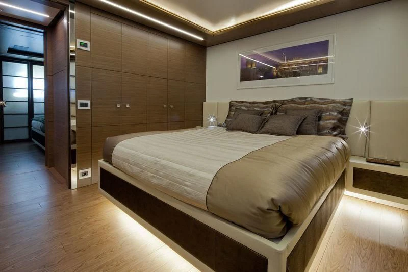 a bed in a room aboard AZIZA Yacht for Sale