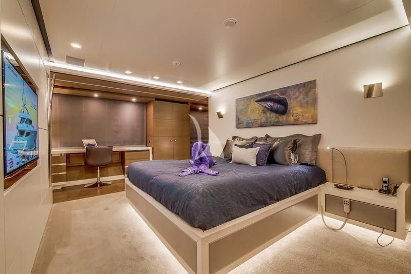 a bed in a room aboard AZIZA Yacht for Sale