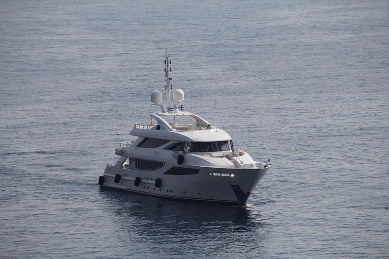 a white boat in the water aboard AZIZA Yacht for Sale