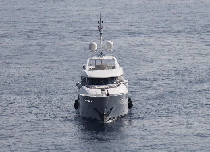 a large ship in the water aboard AZIZA Yacht for Sale