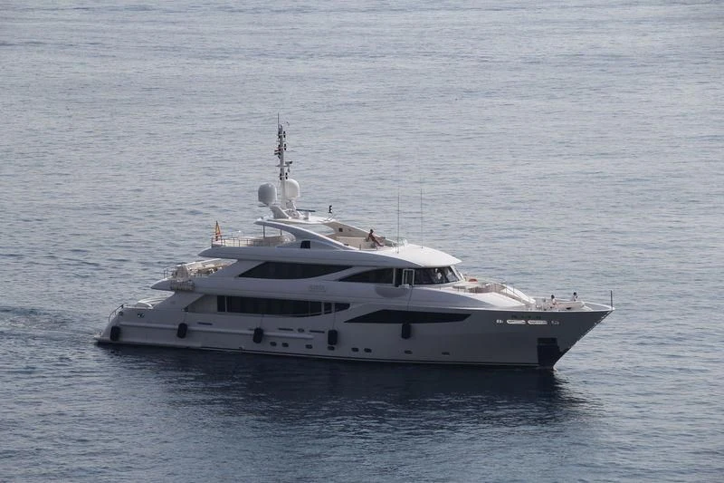 a white yacht in the water aboard AZIZA Yacht for Sale