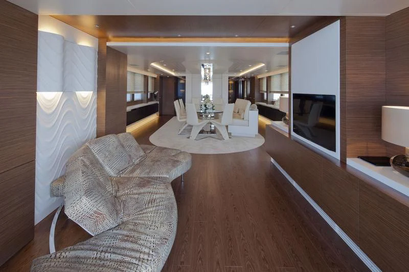a living room with a wood floor aboard AZIZA Yacht for Sale
