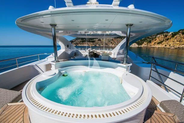 a large white swimming pool aboard AZIZA Yacht for Sale