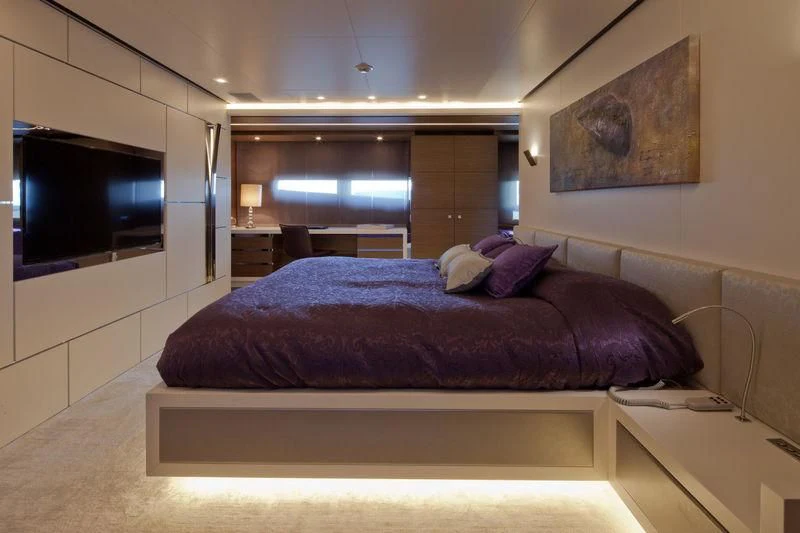 a bed in a room aboard AZIZA Yacht for Sale