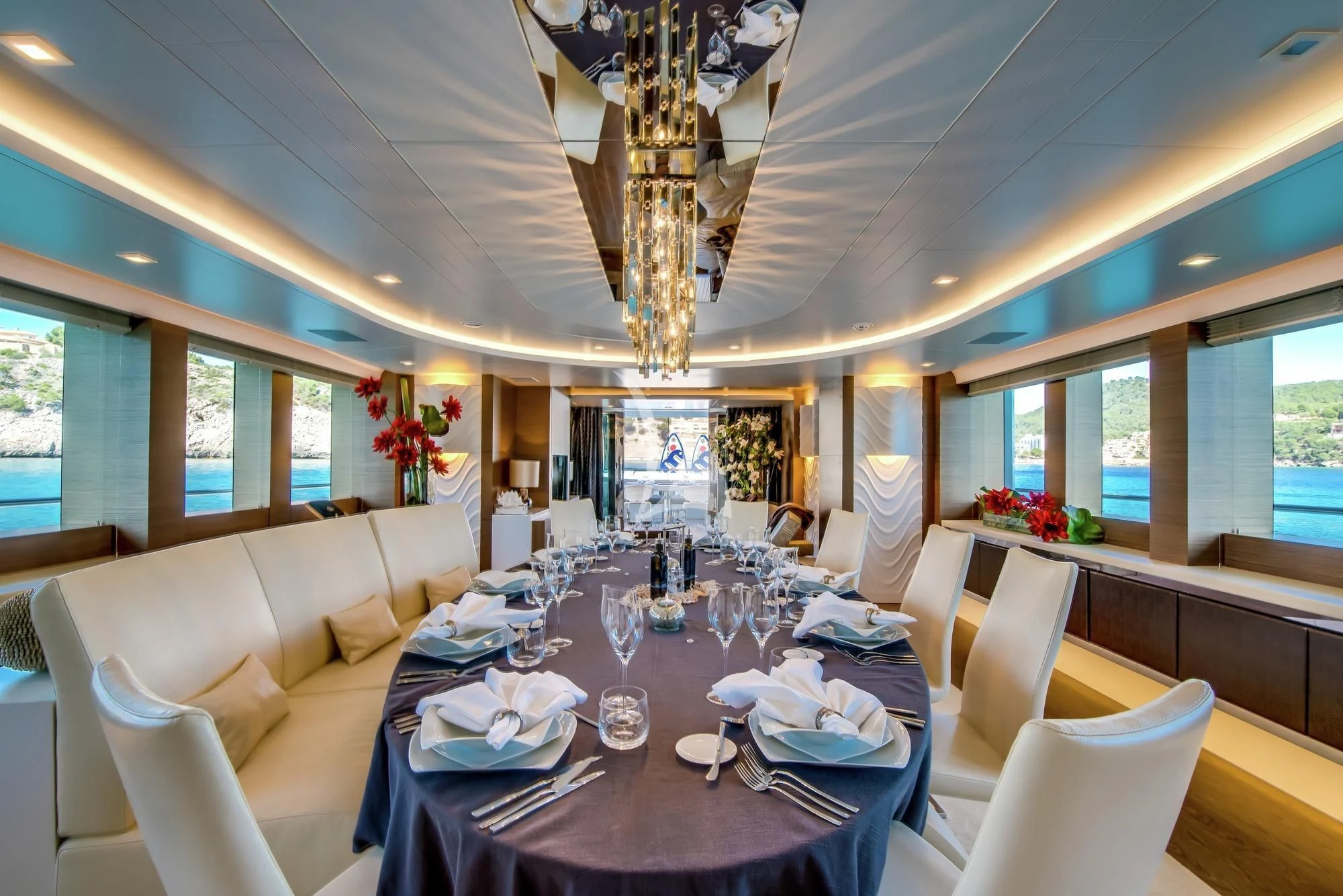 a dining room with a table set aboard AZIZA Yacht for Sale