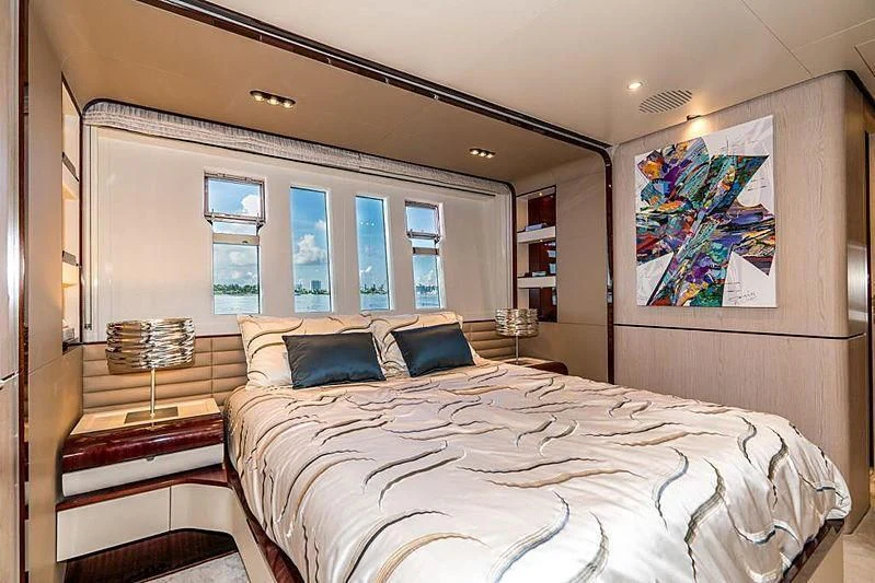 a bedroom with a large bed aboard BLACKJACK Yacht for Sale