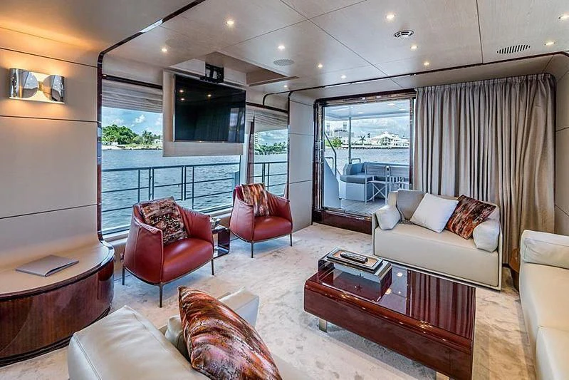 a living room with a large window aboard BLACKJACK Yacht for Sale