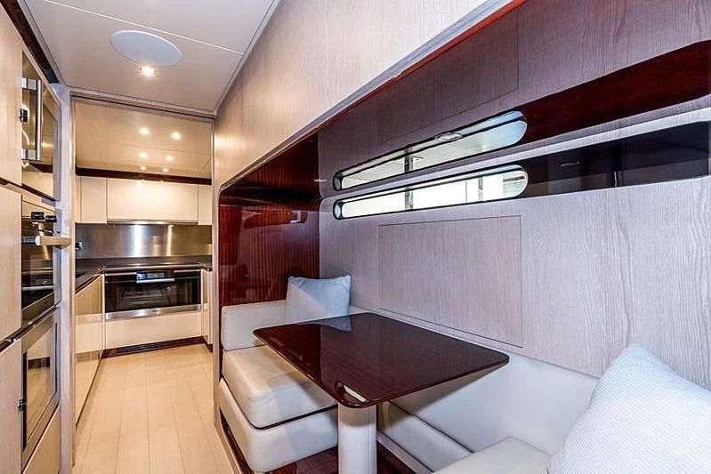 a room with a couch and a table aboard BLACKJACK Yacht for Sale