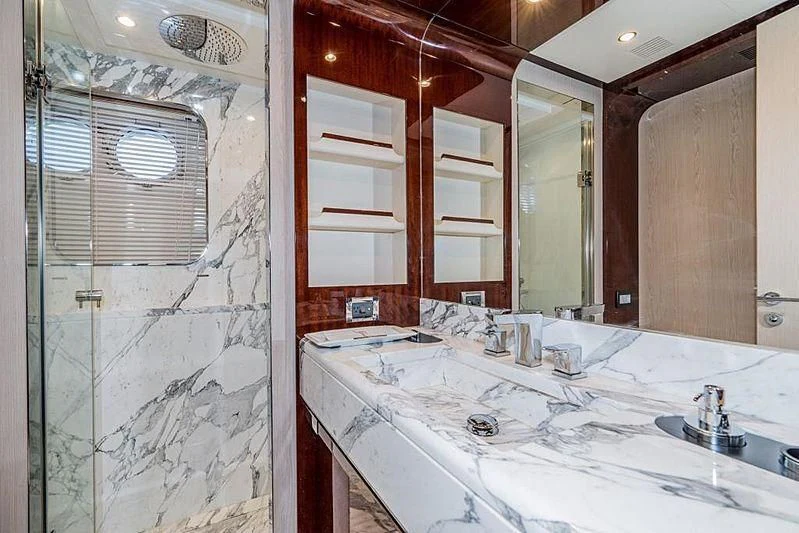 a bathroom with a large mirror aboard BLACKJACK Yacht for Sale