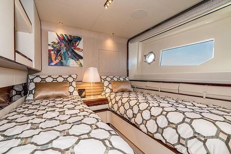 a room with two beds aboard BLACKJACK Yacht for Sale