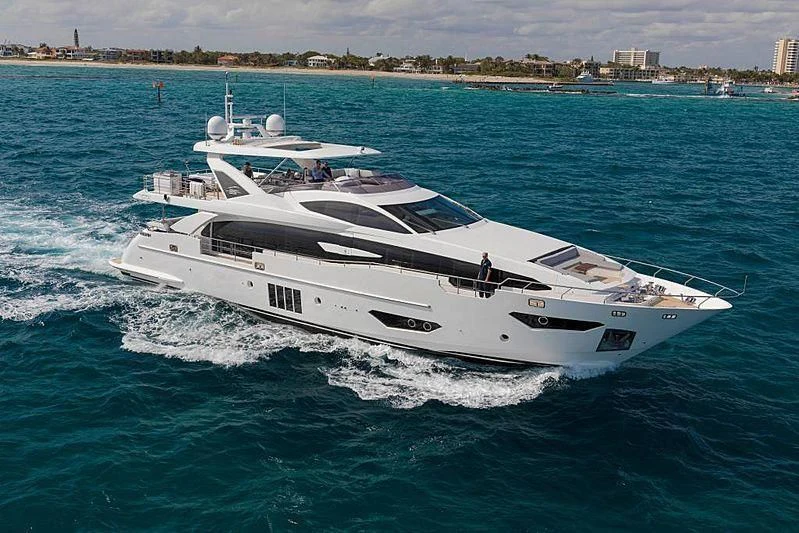 a white yacht on the water aboard BLACKJACK Yacht for Sale