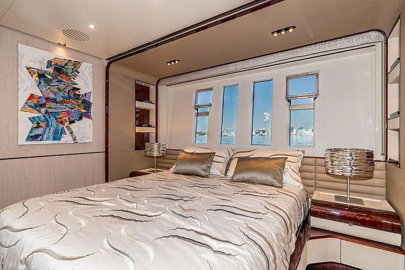 a bedroom with a large bed aboard BLACKJACK Yacht for Sale