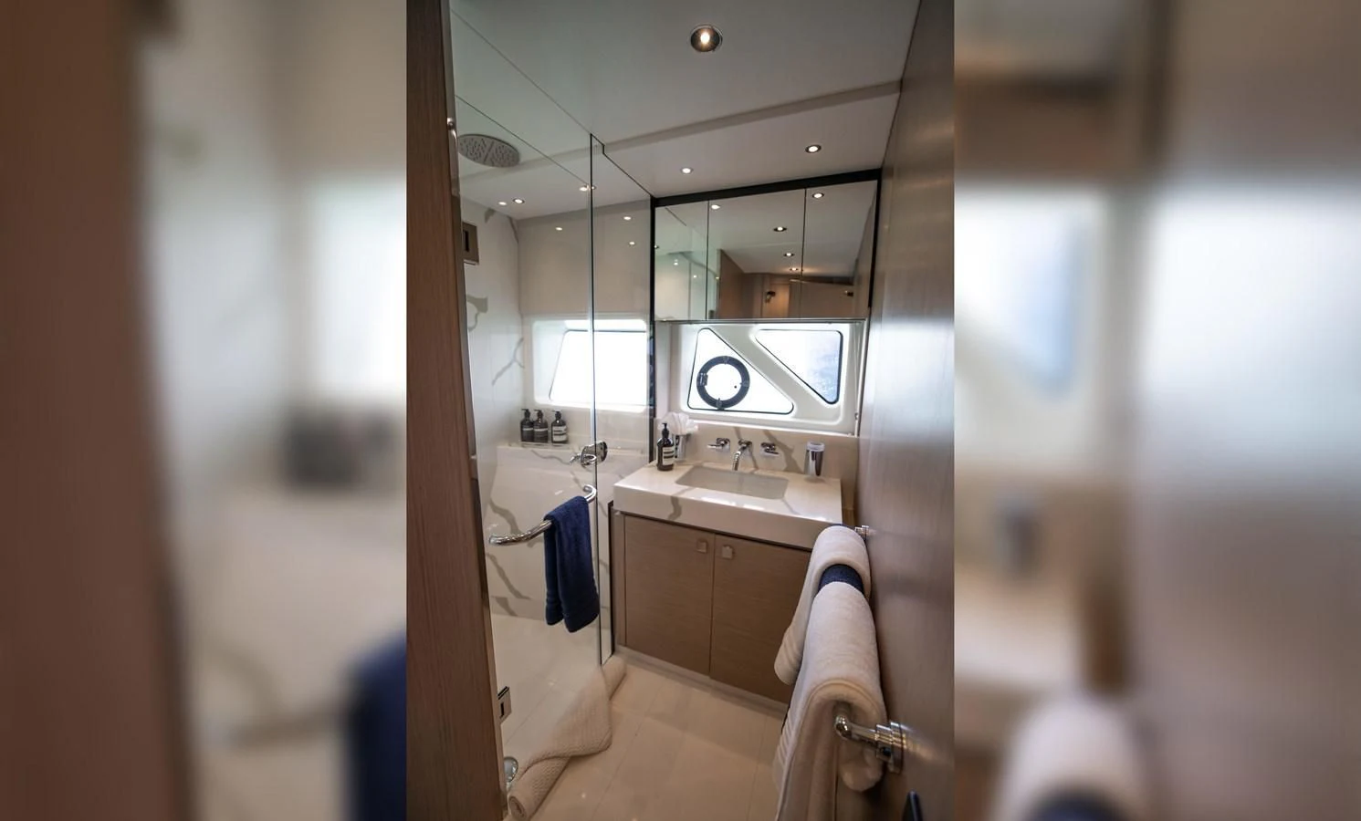 a bathroom with a large mirror aboard MILAMO Yacht for Sale